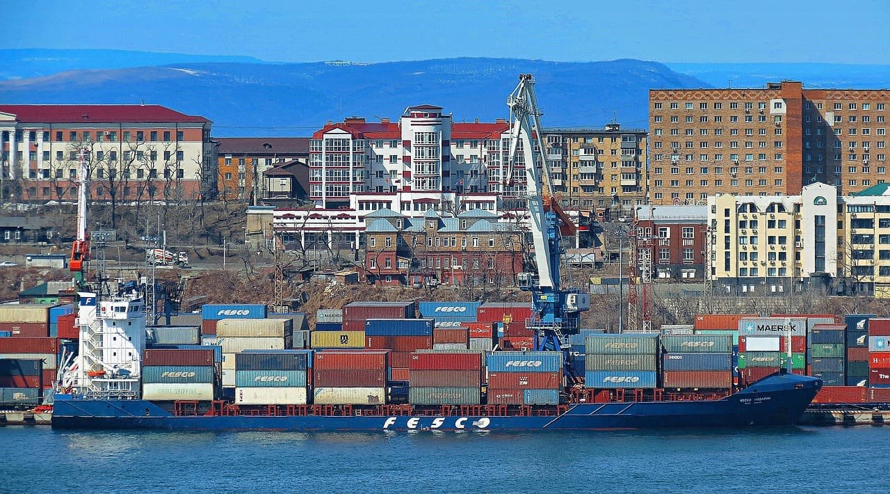 Container ship with FESCO markings at a quay, illustrating Japan to Russia sea freight arriving at Vladivostok