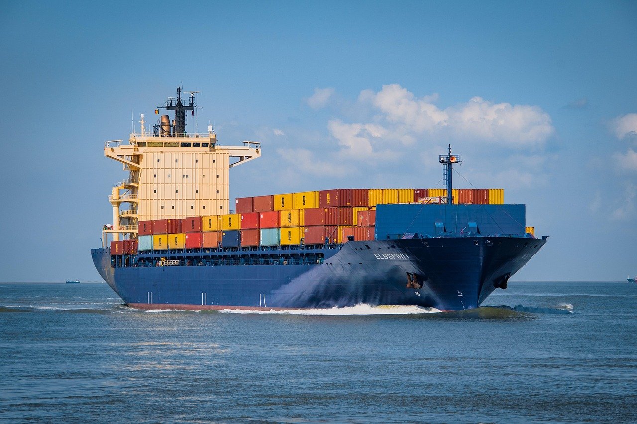 Large container ship at sea fully loaded with containers