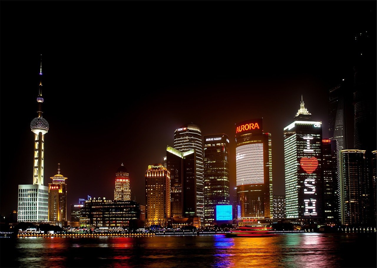 Shanghai skyline at night representing China's export economy
